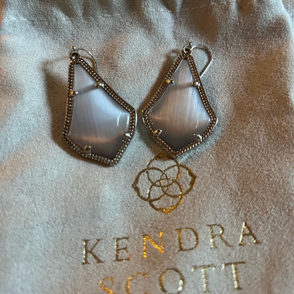 Kendra Scott drop earrings.
